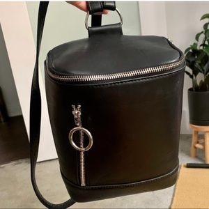 UNIF barrel style mini backpack, black with silver hardware